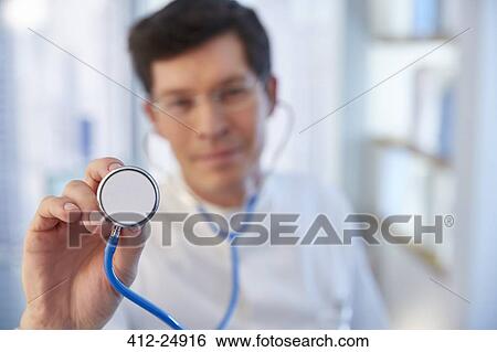 Man reaching towards camera with stethoscope in laboratory View Large Photo Image Stock Photograph - Man reaching towards camera with stethoscope in laboratory. Fotosearch