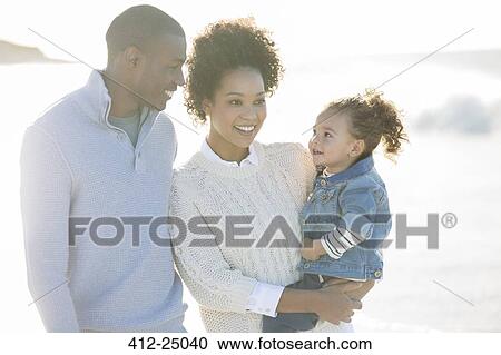Portrait of happy family in sunlight View Large Photo Image Stock Image - Portrait of happy family in sunlight. Fotosearch