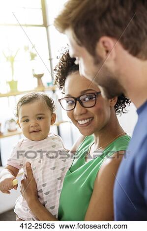 Portrait of parents with baby daughter View Large Photo Image Stock Photography - Portrait of parents with baby daughter. Fotosearch