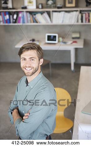 Portrait of young blonde man standing in studio View Large Photo Image Stock Photo - Portrait of young blonde man standing in studio. Fotosearch