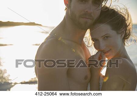Portrait of young couple on beach View Large Photo Image Picture - Portrait of young couple on beach. Fotosearch