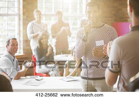 Audience clapping for smiling speaker View Large Photo Image Stock Image - Audience clapping for smiling speaker. Fotosearch