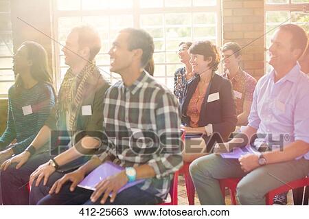 Audience smiling in community center View Large Photo Image Stock Image - Audience smiling in community center. Fotosearch
