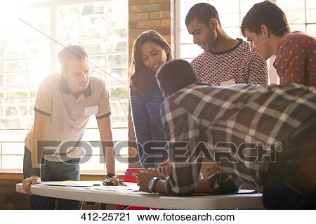 Creative business people meeting around table View Large Photo Image Stock Image - Creative business people meeting around table. Fotosearch