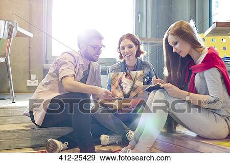 Creative business people working on steps View Large Photo Image Stock Photo - Creative business people working on steps. Fotosearch
