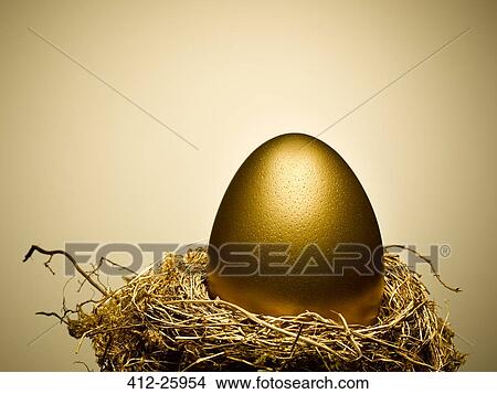Golden egg on gold nest still life View Large Photo Image Picture - Golden egg on gold nest still life. Fotosearch