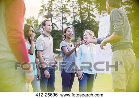 Group around flipchart in field View Large Photo Image Stock Photograph - Group around flipchart in field. Fotosearch