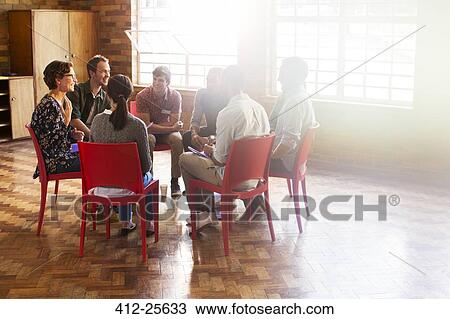 group therapy session in circle in sunny community center View Large Photo Image Stock Image - group therapy session in circle in sunny community center. Fotosearch