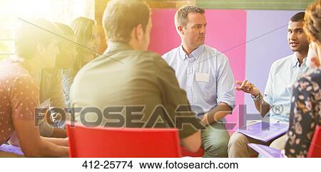 Man speaking in group therapy session View Large Photo Image Picture - Man speaking in group therapy session. Fotosearch