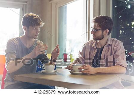 Men talking and drinking coffee in cafe View Large Photo Image Stock Photo - Men talking and drinking coffee in cafe. Fotosearch