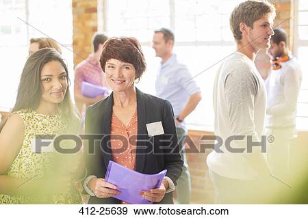 Stock Photo - Portrait of smiling women at community center. Fotosearch