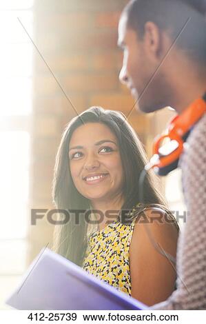 Smiling businessman and businesswoman in meeting View Large Photo Image Stock Photo - Smiling businessman and businesswoman in meeting. Fotosearch