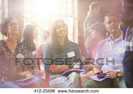 Smiling people talking in community center View Large Photo Image Stock Photograph - Smiling people talking in community center. Fotosearch