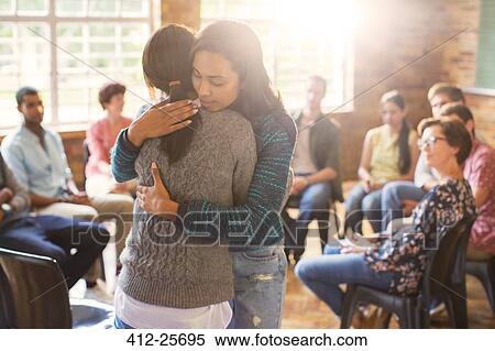 Women hugging in group therapy session View Large Photo Image Stock Photography - Women hugging in group therapy session. Fotosearch