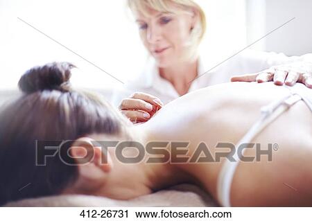 Acupuncturist applying acupuncture needle to woman’s neck View Large Photo Image Stock Image - Acupuncturist applying acupuncture needle to woman’s neck. Fotosearch