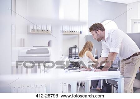 Stock Photo - Architect working at laptop in office. Fotosearch