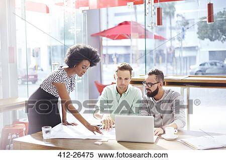 Architects discussing blueprints in sunny cafe View Large Photo Image Stock Photography - Architects discussing blueprints in sunny cafe. Fotosearch