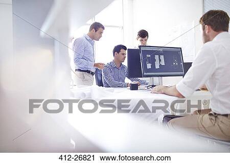 Architects drafting blueprints at computers in office View Large Photo Image Stock Image - Architects drafting blueprints at computers in office. Fotosearch