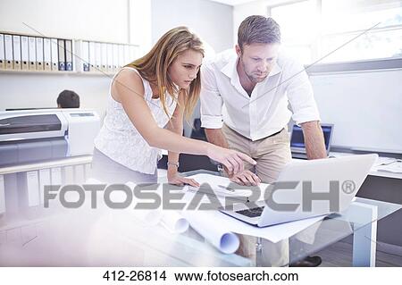 Architects using laptop in office View Large Photo Image Picture - Architects using laptop in office. Fotosearch
