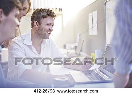 Architects using laptop in office View Large Photo Image Stock Image - Architects using laptop in office. Fotosearch