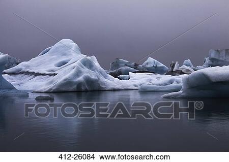 "Blue icebergs in calm water, Jokulsarlon, Iceland" View Large Photo Image Picture - "Blue icebergs in calm water, Jokulsarlon, Iceland". Fotosearch