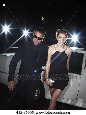 Stock Photography - Bodyguard escorting celebrity arriving at event. Fotosearch