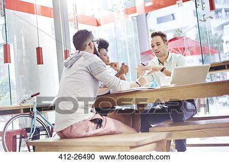 Business people meeting in cafe View Large Photo Image Stock Image - Business people meeting in cafe. Fotosearch