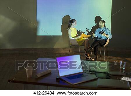Business people preparing audio visual presentation in conference room View Large Photo Image Picture - Business people preparing audio visual presentation in conference room. Fotosearch