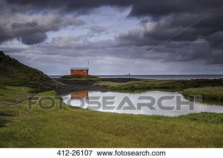 "Calm pool and red building, Skalavik, Isafjordur, West Fjords, Iceland" View Large Photo Image Stock Photo - "Calm pool and red building, Skalavik, Isafjordur, West Fjords, Iceland". Fotosearch