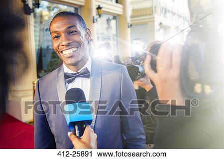 Celebrity being interviewed and photographed by paparazzi photographers View Large Photo Image Stock Image - Celebrity being interviewed and photographed by paparazzi photographers. Fotosearch