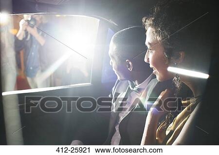 Celebrity couple in limousine arriving at red carpet event View Large Photo Image Stock Image - Celebrity couple in limousine arriving at red carpet event. Fotosearch
