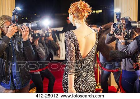 Celebrity leaving and being photographed by paparazzi photographers at red carpet event View Large Photo Image Stock Image - Celebrity leaving and being photographed by paparazzi photographers at red carpet event. Fotosearch