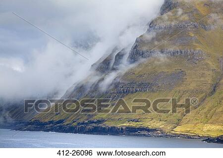 "Clouds along cliffs, Funningur, Eysturoy, Faroe Islands" View Large Photo Image Stock Photograph - "Clouds along cliffs, Funningur, Eysturoy, Faroe Islands". Fotosearch
