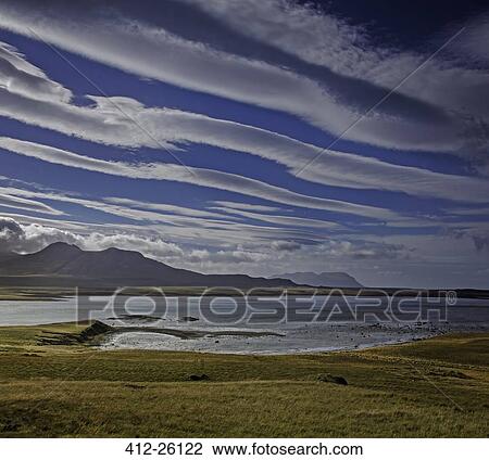 "Clouds forming lines over lake and mountain landscape, Snaefellsnes, Iceland" View Large Photo Image Stock Image - "Clouds forming lines over lake and mountain landscape, Snaefellsnes, Iceland". Fotosearch