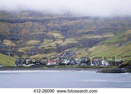"Coastal village below green cliffs, Vagar, Faroe Islands" View Large Photo Image Stock Image - "Coastal village below green cliffs, Vagar, Faroe Islands". Fotosearch