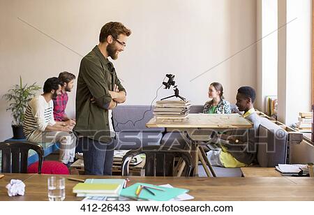 Stock Image - Creative business people working in office. Fotosearch