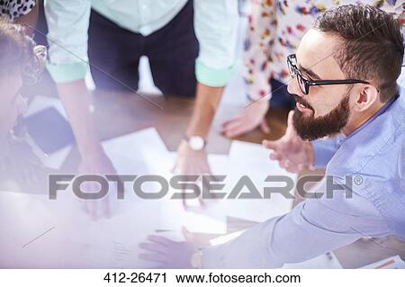 Creative businessman leading meeting View Large Photo Image Stock Image - Creative businessman leading meeting. Fotosearch