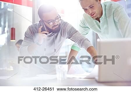 Creative businessmen reviewing blueprints View Large Photo Image Stock Image - Creative businessmen reviewing blueprints. Fotosearch