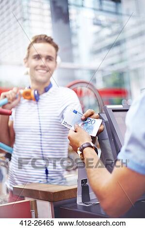 Customer paying worker in cafe with twenty Euro banknote View Large Photo Image Stock Photography - Customer paying worker in cafe with twenty Euro banknote. Fotosearch