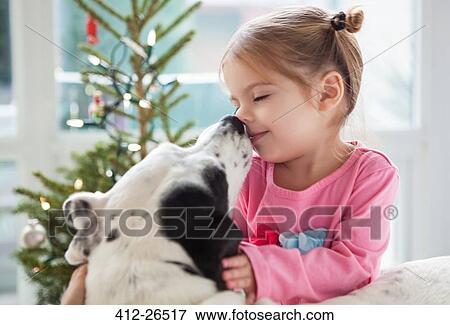 Dog licking girl’s face View Large Photo Image Stock Photo - Dog licking girl’s face. Fotosearch