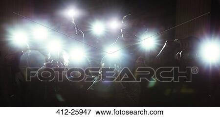 Lens flash of paparazzi photographers’ cameras View Large Photo Image Stock Photo - Lens flash of paparazzi photographers’ cameras. Fotosearch