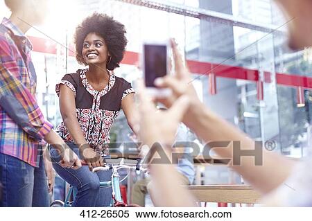 Man photographing women in cafe View Large Photo Image Stock Photography - Man photographing women in cafe. Fotosearch