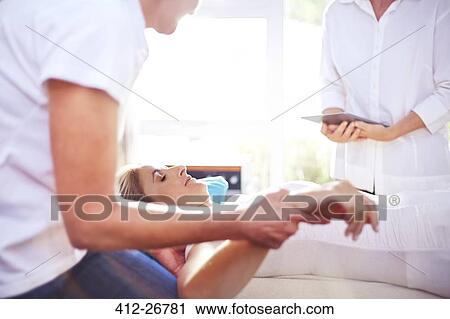 Masseuse massaging woman’s hand View Large Photo Image Stock Image - Masseuse massaging woman’s hand. Fotosearch