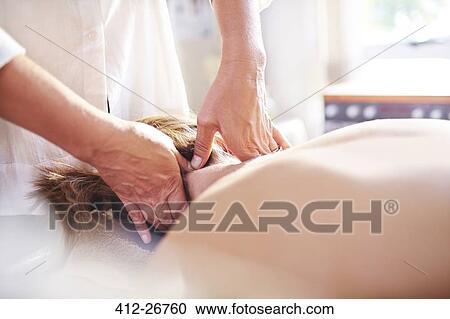 Masseuse massaging woman’s neck View Large Photo Image Stock Image - Masseuse massaging woman’s neck. Fotosearch