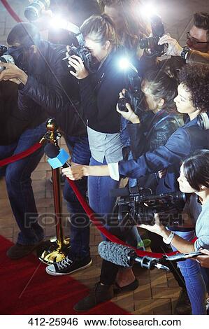 Paparazzi photographers and reporters at red carpet event View Large Photo Image Stock Photograph - Paparazzi photographers and reporters at red carpet event. Fotosearch