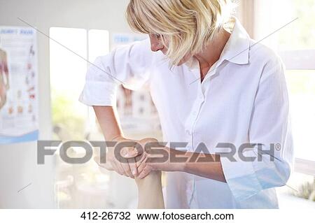 Physical therapist massaging patient’s foot View Large Photo Image Stock Image - Physical therapist massaging patient’s foot. Fotosearch