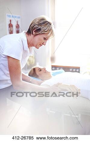 Physical therapist massaging woman’s hand View Large Photo Image Stock Photography - Physical therapist massaging woman’s hand. Fotosearch