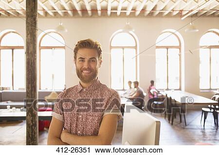 Portrait confident casual businessman in sunny office View Large Photo Image Stock Image - Portrait confident casual businessman in sunny office. Fotosearch