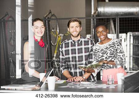 Portrait creative business people working in office View Large Photo Image Stock Photo - Portrait creative business people working in office. Fotosearch