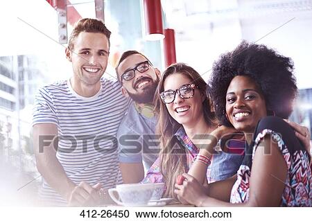 Portrait of smiling friends in cafe View Large Photo Image Stock Image - Portrait of smiling friends in cafe. Fotosearch